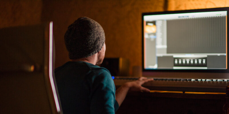 Musician writes music at studio