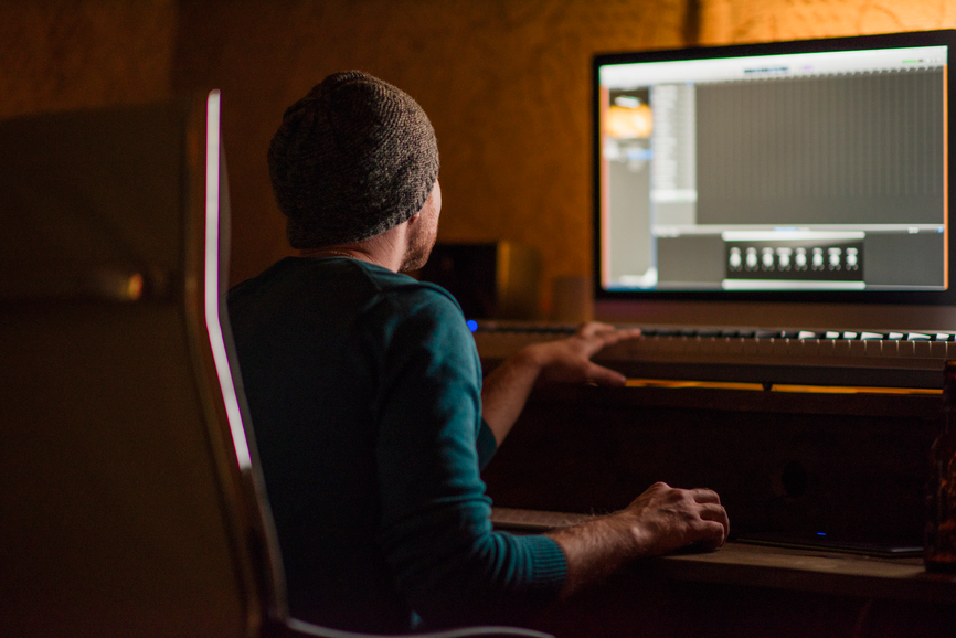 Musician writes music at studio
